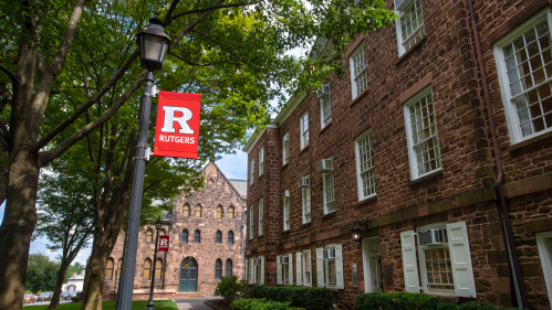 Block R banner behind Winants on Old Queens campus